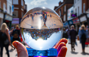 Shopping crowd seen through a crystal ball